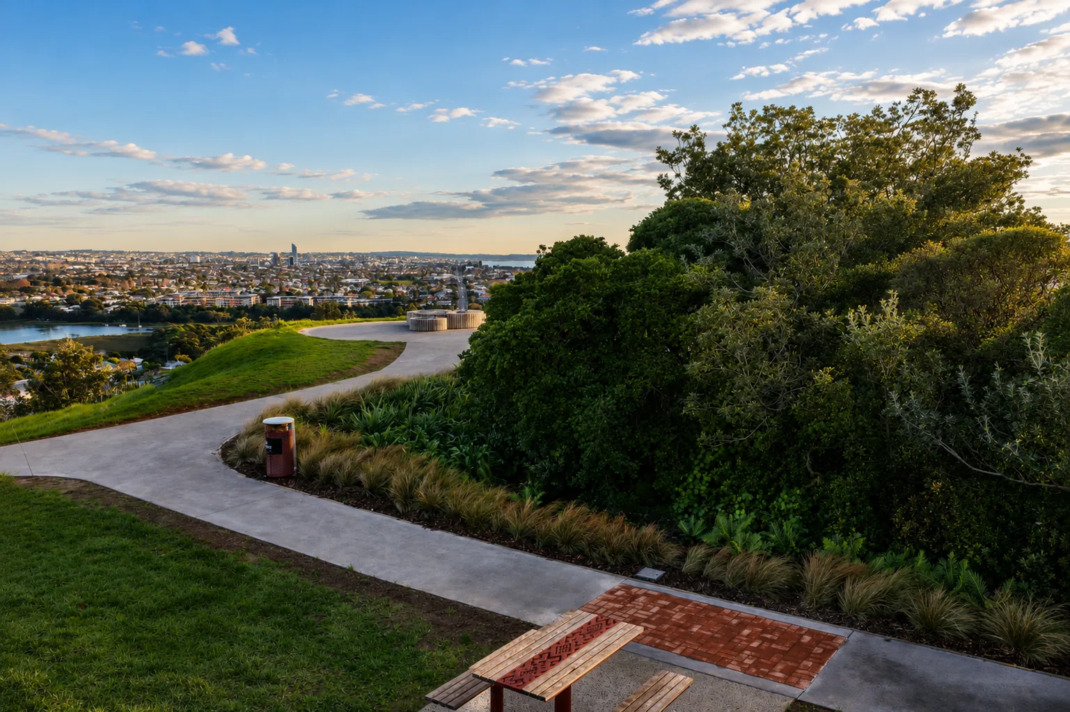 Takarunga Tihi lookout with Auckland skyline and native planting