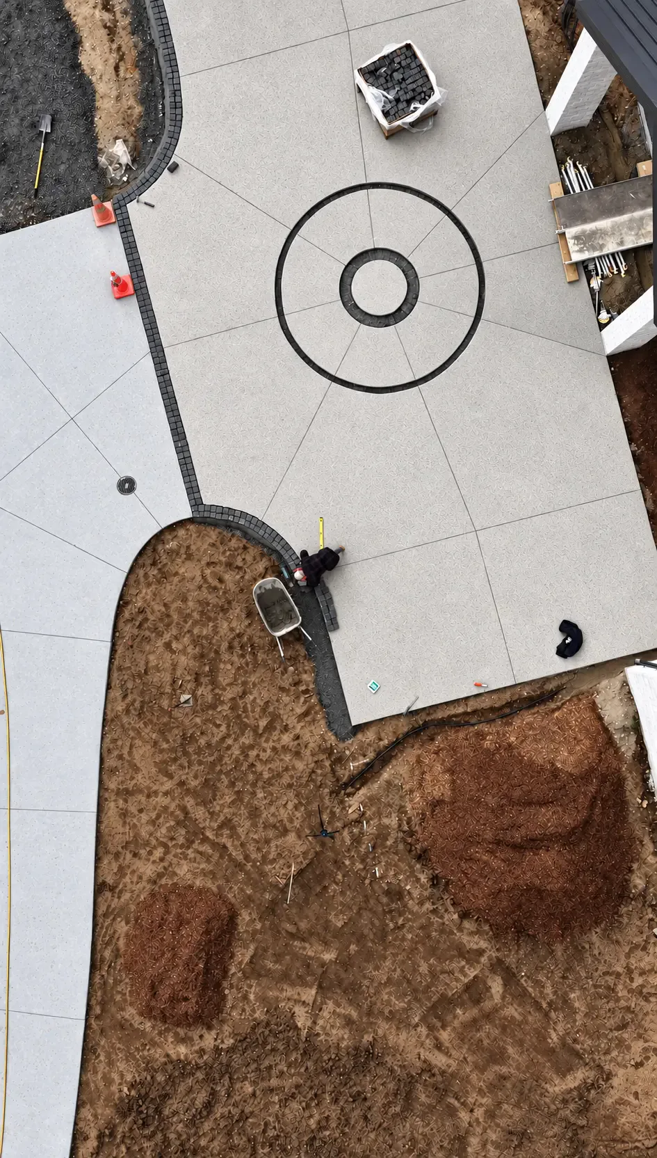 Aerial view of the Coatesville Riverhead Highway entrance paving and circular cobblestone detailing during construction