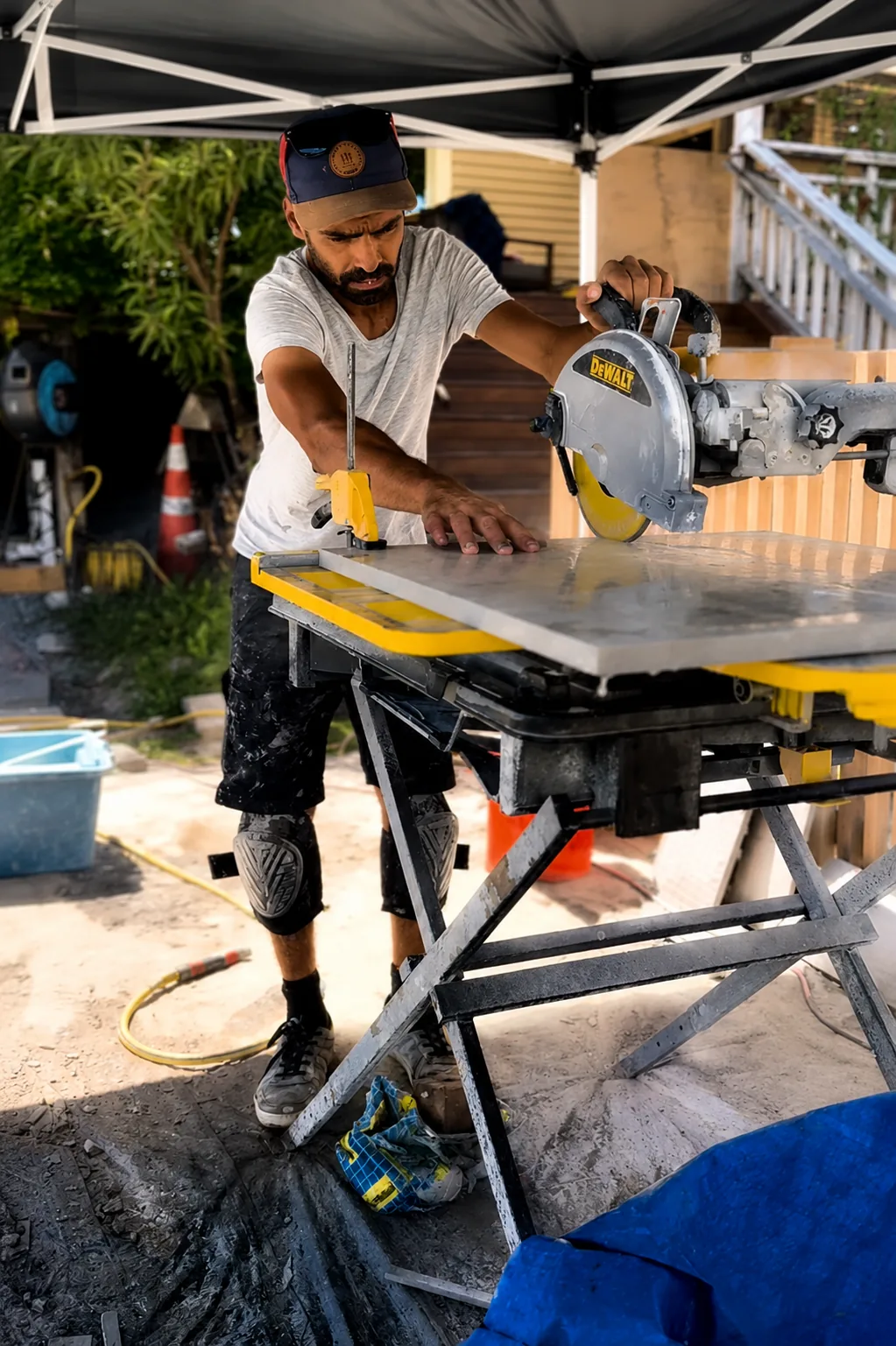 Cutting stone pavers on site at Kia Ora Road