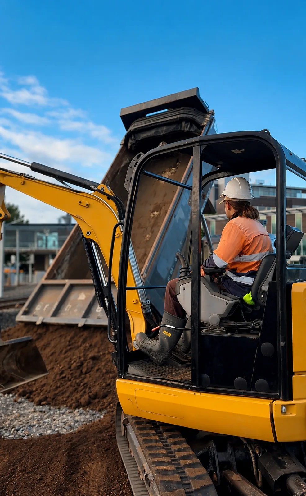 Planters operator in excavator during landscape construction