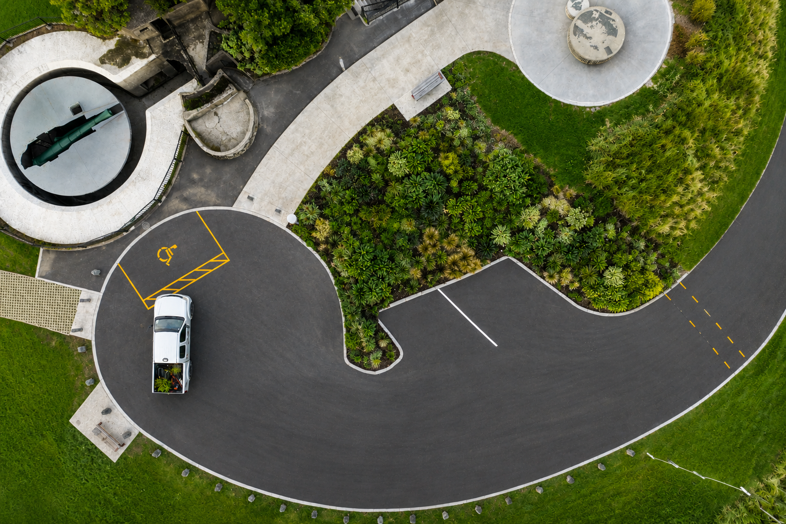 Aerial view of Takarunga Tihi native planting, historic gun turret and Auckland harbour